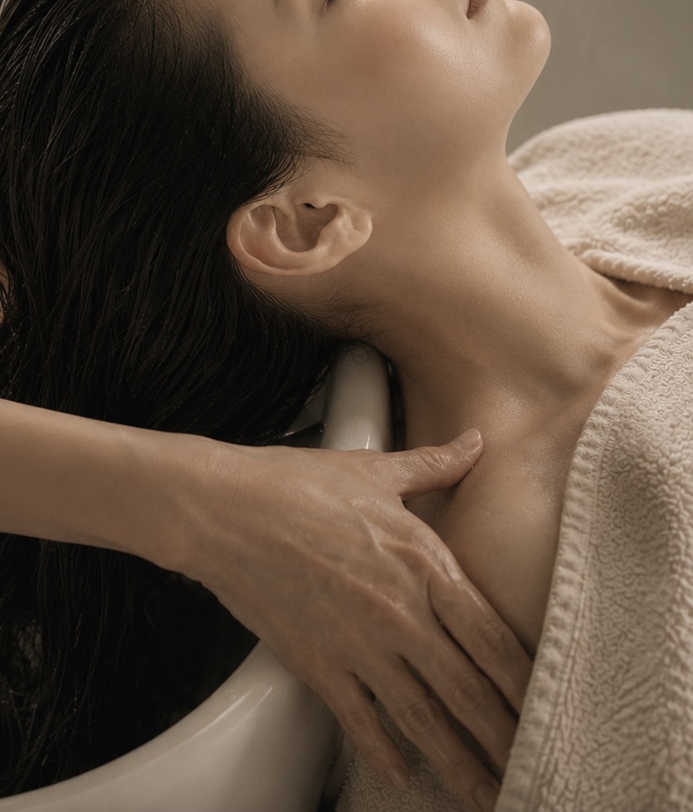 Therapist massaging a guest's neck and shoulders
